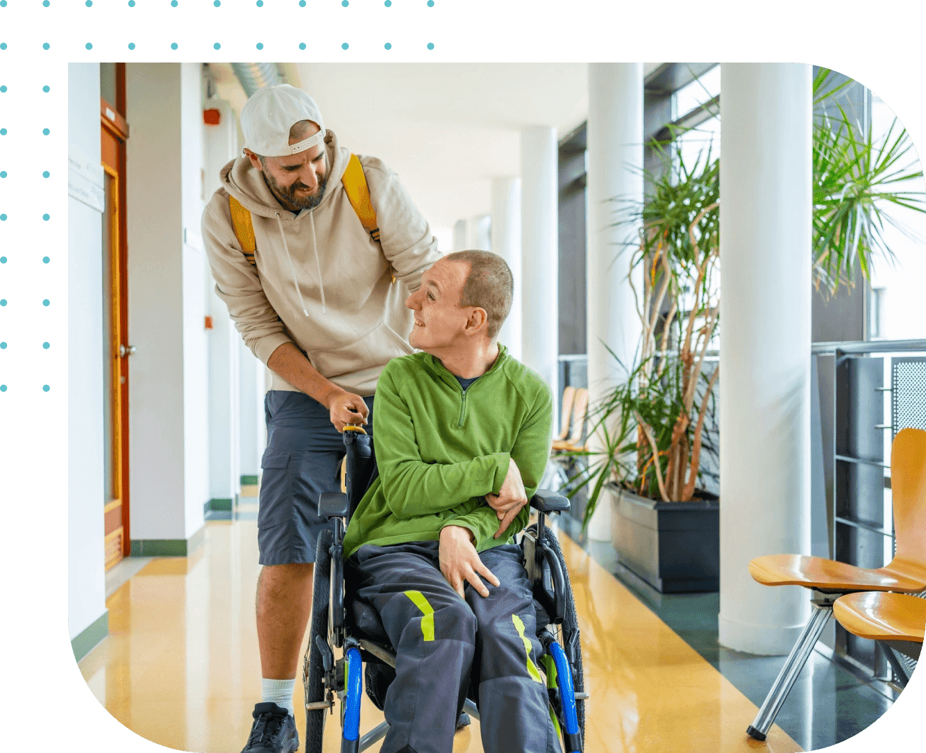 A man pushing another man in a wheelchair. A man pushing another man in a wheelchair.