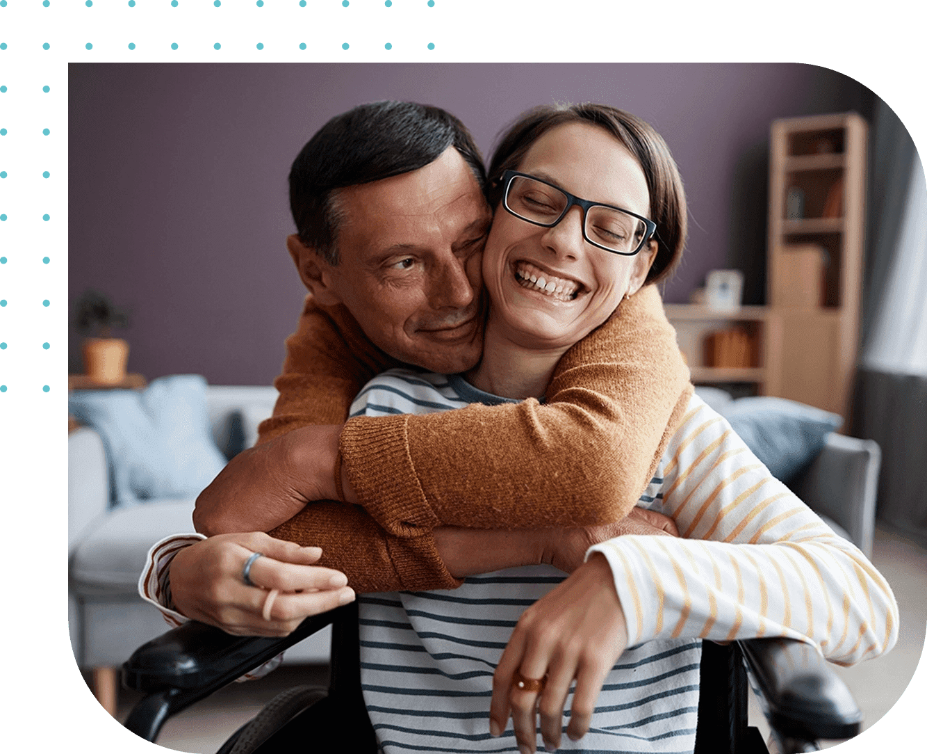 A man and woman hugging in a living room.