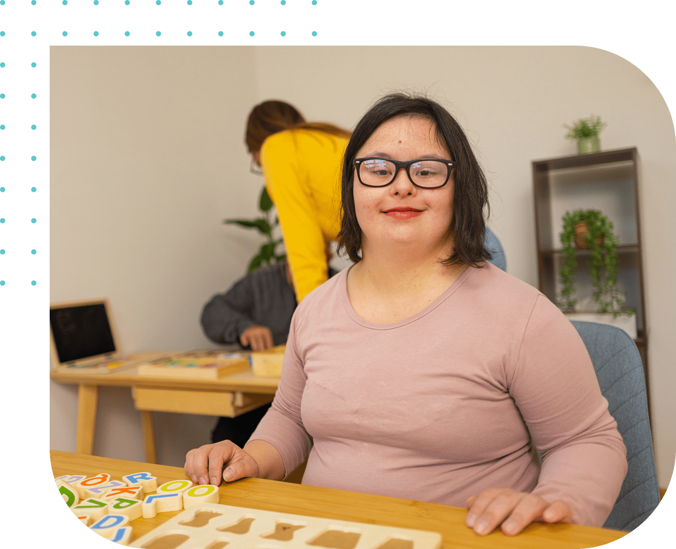 A woman sitting at a table with a puzzle. A woman sitting at a table with a puzzle.