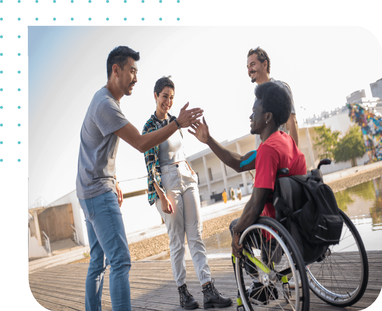 Group of friends smiling by the water.