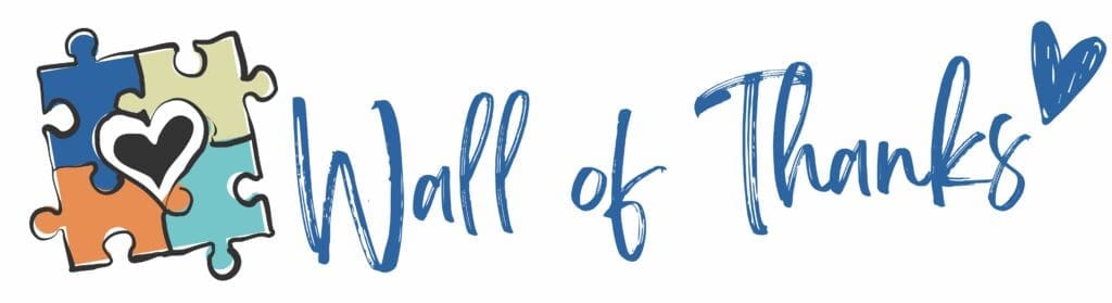 Wall of Thanks" with colorful puzzle pieces.