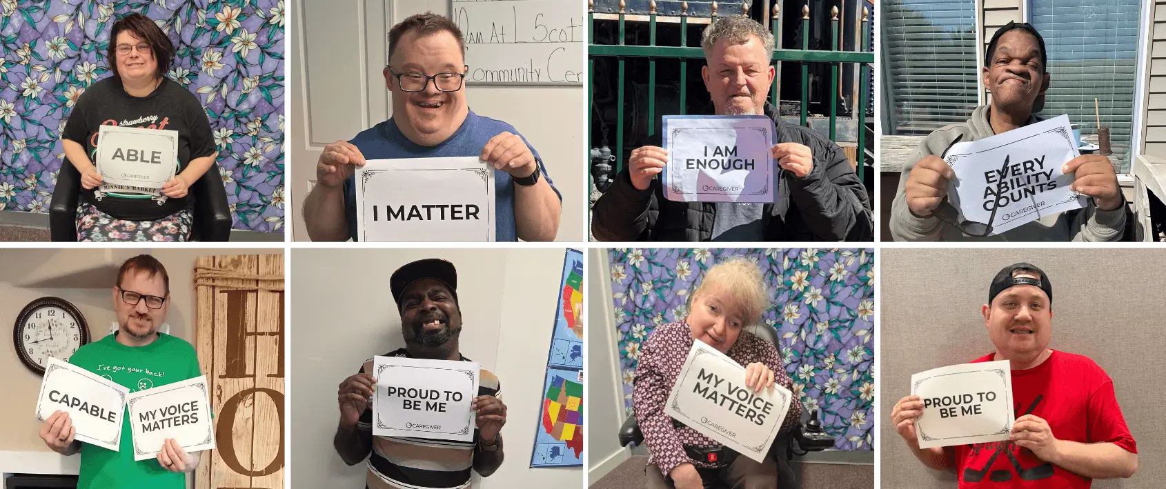 People holding positive affirmation signs, smiling.