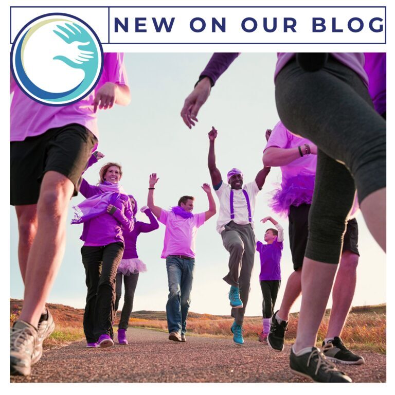 A group of people in purple shirts and black shorts. A group of people in purple shirts and black shorts.