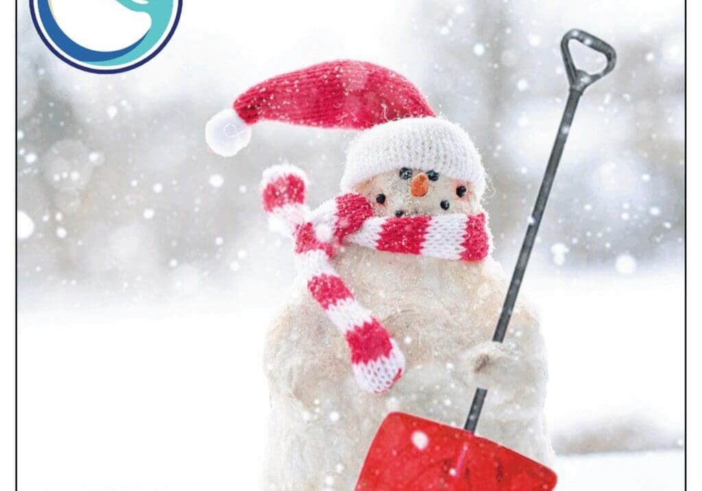 Snowman with red shovel and scarf.