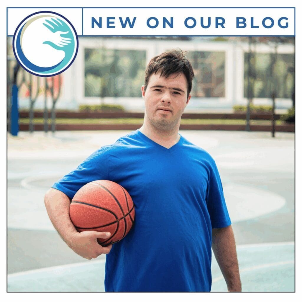 Man holding basketball on outdoor court.